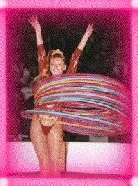 Miss Ashley Winn with many colored hula hoops going at once.
