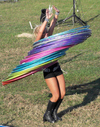 Ashley Winn keeps fifty hula hoops in constant motion