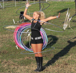 Ashley Winn keeps four hula hoops spinning around her body