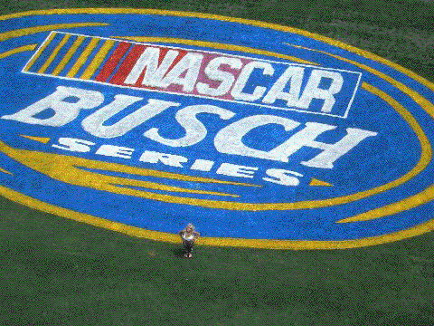 Taken from 127 feet on the Galaxy Girl sway pole, Tina poses by the NASCAR Busch Series logo.